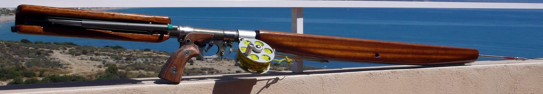 Aquatech Black Sea gun with timber buoyancy jacket.jpg